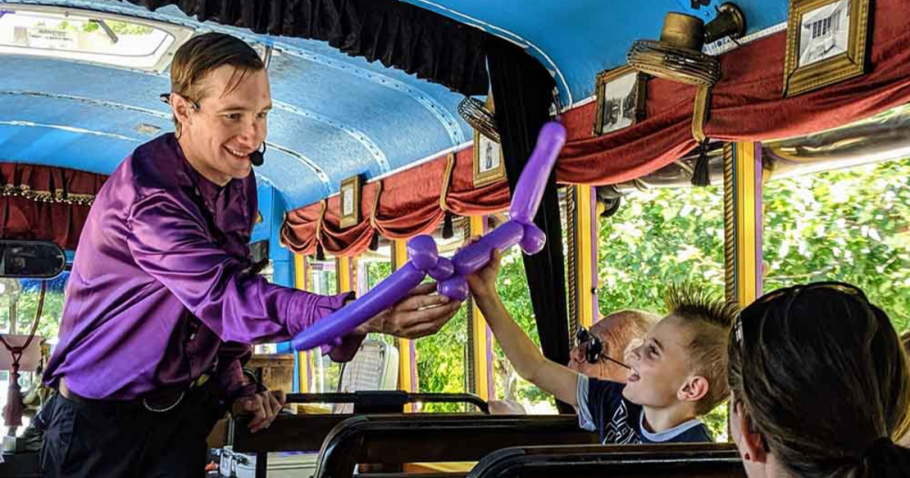 Man Folding Balloon on Bus