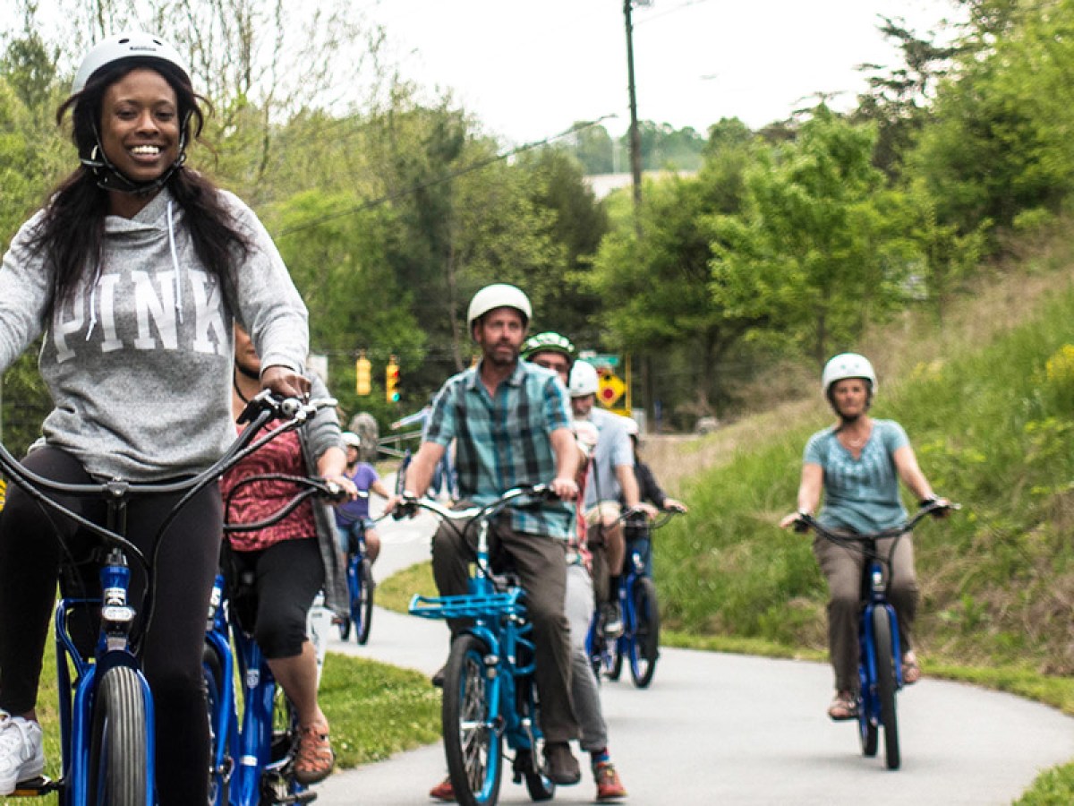 Group of people on a bike tour along Asheville greenways