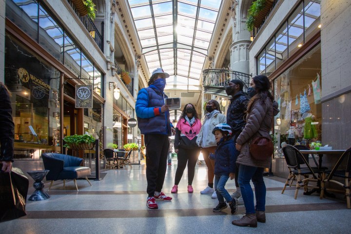A tour guide and family shopping during a tour of Asheville area attractions