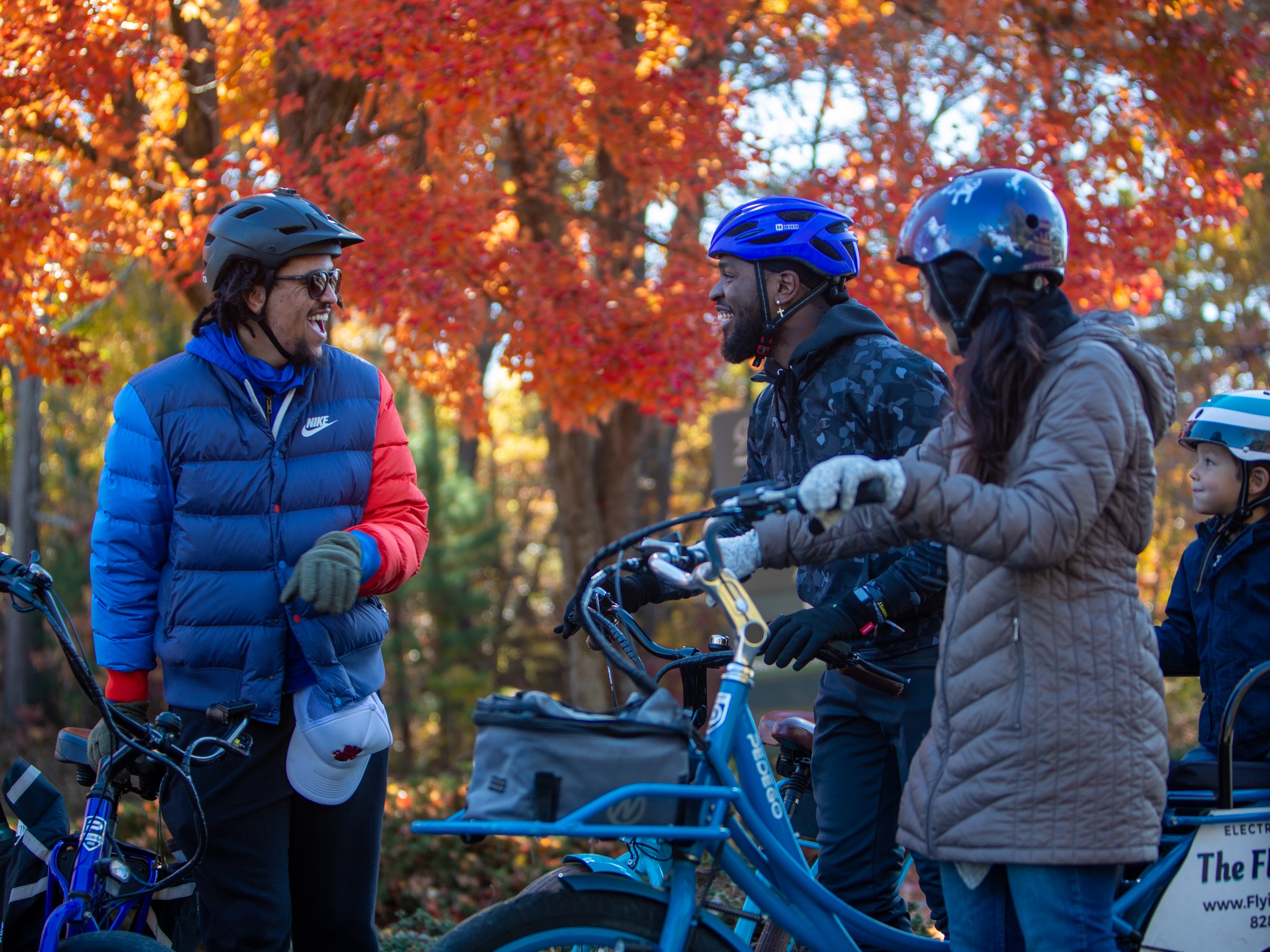 Two happy guests chat with their tour guide.